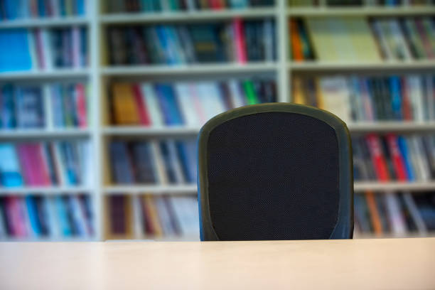 istock wooden table standing in front of bookshelf 1284898203