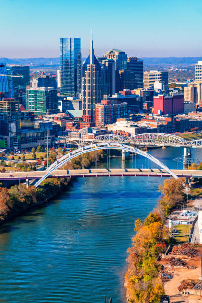 Nashville, Tennesee Skyline Aerial view of the skyline of beautiful Nashville, Tennessee, known as "Music City" along the banks of the Cumberland River. nashville tennessee bridge stock pictures, royalty-free photos & images