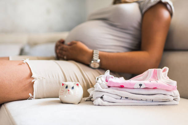 istock Pregnant woman saving up for baby 1284906792