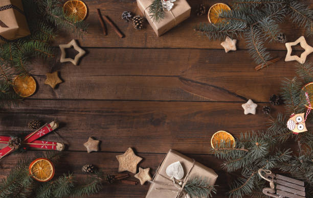 istock Zero waste Christmas flat lay on brown wooden background. Eco and natural wrapping. Frame. 1284906830