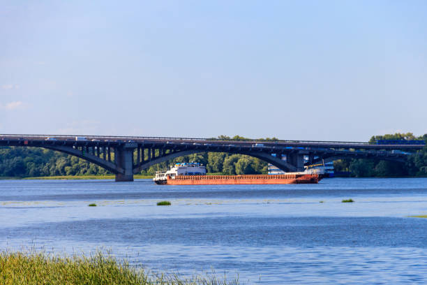 istock Heavy long barge sailing on the Dnieper river in Kiev, Ukraine 1284908550