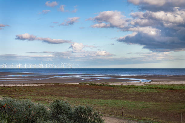 istock Lincolnshire Coast, with offshore wind turbines, England 1284909395