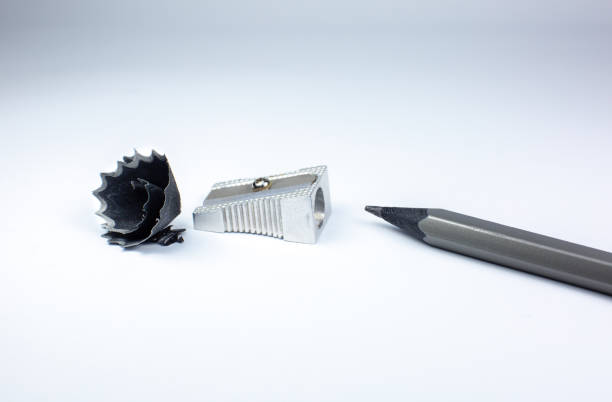istock Sharpener and a broken pencil. Shavings and a graphite on white background. Close up photo. 1284909534