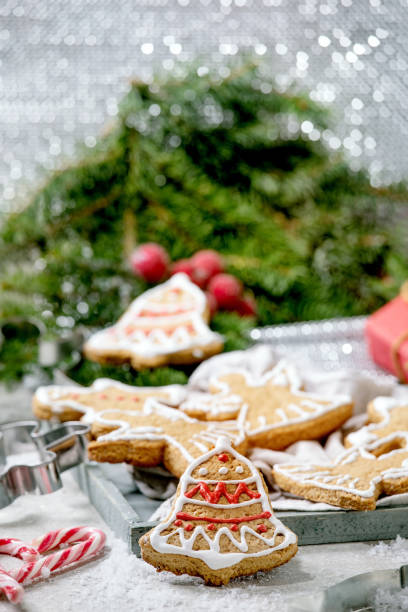 istock Christmas gingerbread cookies with icing ornate. Xmas decorations, white background. 1284909755