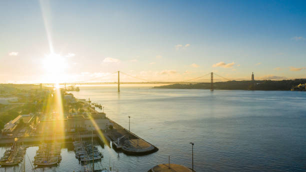 istock River, bridge and city at sunset 1284912658