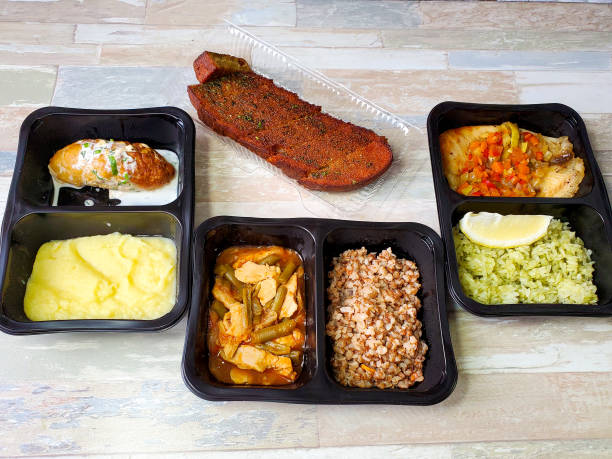 istock Plastic containers with delicious food on an isolated background. Delivery service 1284912735