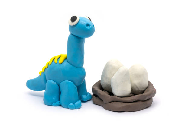 istock Play dough Brachiosaurus and egg on white background. Handmade clay plasticine 1284914523