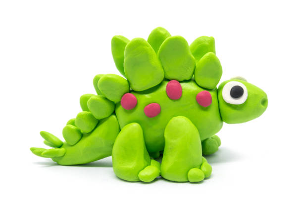 istock Play dough Stegosaurus on white background. Handmade clay plasticine 1284914524