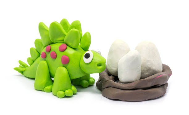 istock Play dough Stegosaurus on white background. Handmade clay plasticine 1284914525