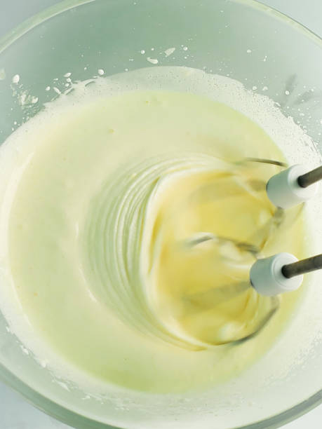 istock Preparation of cake dough using a mixer. We prepare food at home in quarantine 1284916492