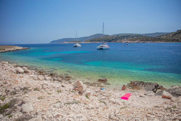 Yachts moored in blue waters bay