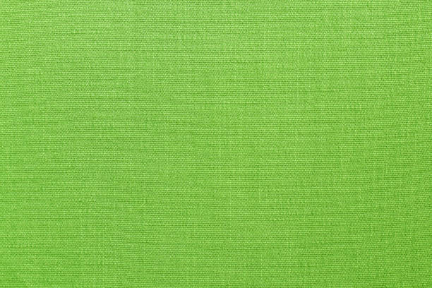 istock Light green linen fabric cloth texture background, seamless pattern of natural textile. 1284920748