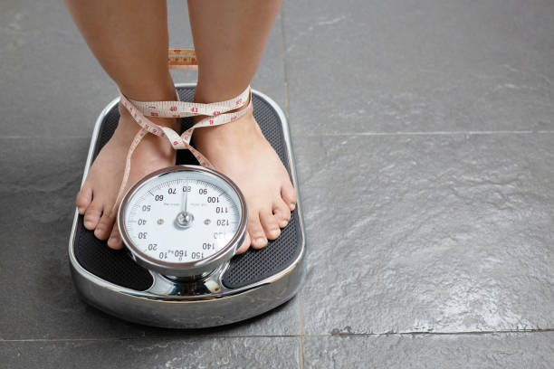 istock Weight Scale for Obese Women 1284922658