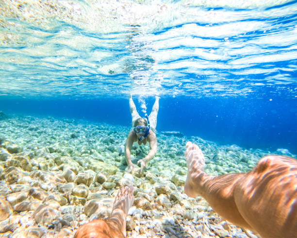 istock Woman diving in sea 1284922833