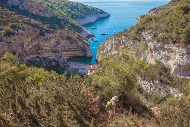 istock Hiking in mountains towering over sea 1284922847
