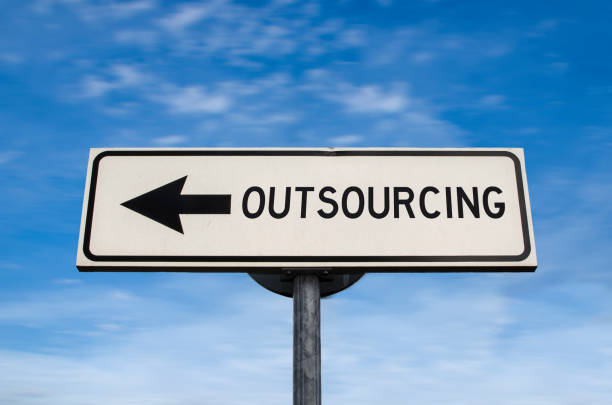 istock Outsourcing work force. White sign with arrow with offshore. Direction sign. Arrows on a pole pointing in one direction. IT offshoring concept. 1284922941