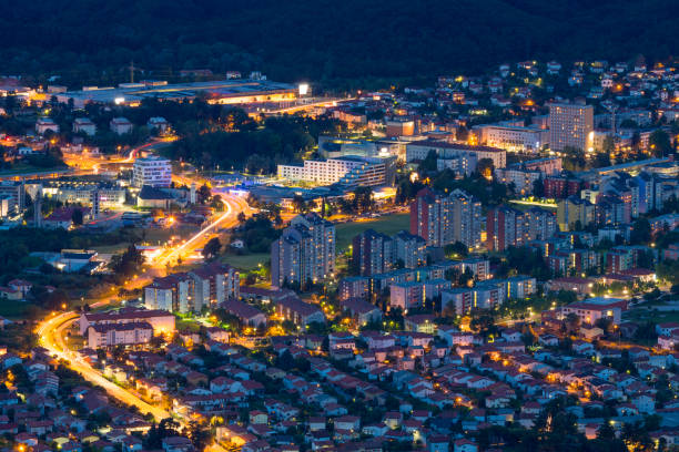 City Life at Night Cityscape at dusk, dawn with lights on showing traffic motion and life in the city of Nova Gorica (Slovenia - Europe) in 2014. nova gorica stock pictures, royalty-free photos & images