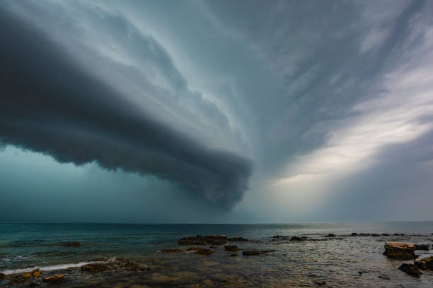 Beach Arcus Cloud Shelf Storm Side view of shelf cloud sea thunderstorm arriving above the Umag beach (Croatia) on 3rd august, 2020. climate justice photos stock pictures, royalty-free photos & images