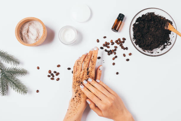 istock Woman's hands apply homemade cosmetic coffee scrub 1284926151