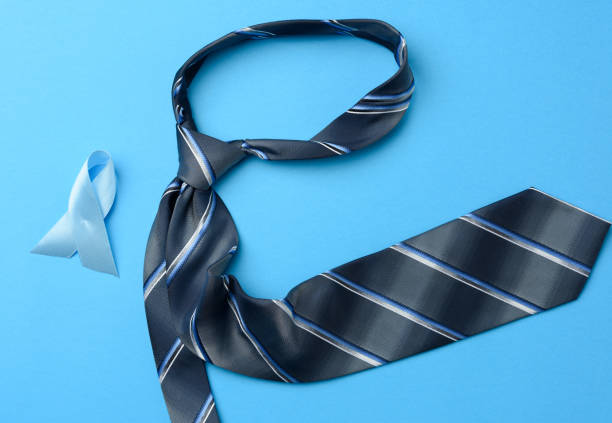 istock silk blue mens tie and ribbon folded in a loop on blue background 1284926216