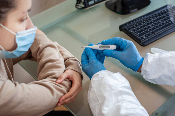 istock The doctor examines a patient with coronavirus. 1284930656