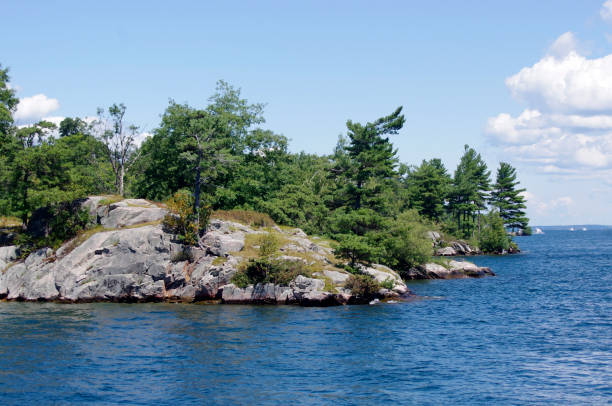 istock Rocky Island IN BLUE RIVER 1284931010