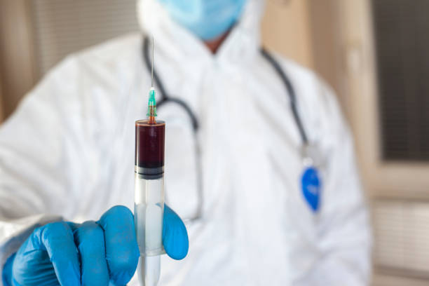Doctor holding coronavirus blood sample Doctor holding coronavirus blood sample Pneumococcal Vaccine stock pictures, royalty-free photos & images