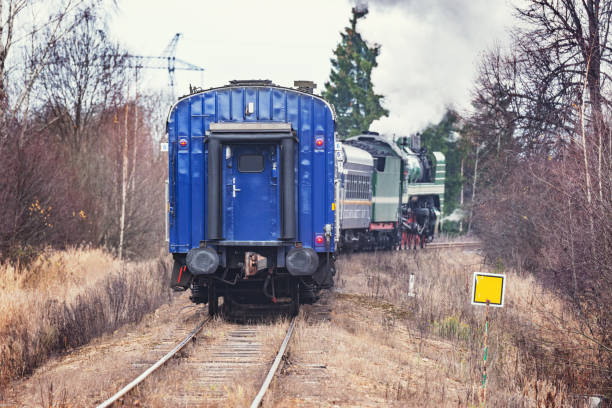 istock Steam train moves at autumn day time. 1284932738