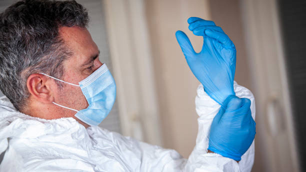 istock Doctor in covid hospital preparing himself for work 1284933991