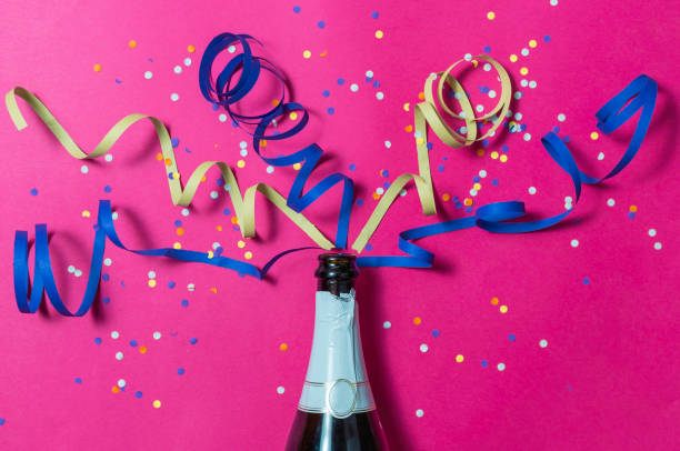 istock Cava bottle, confetti and celebration streamers 1284934360
