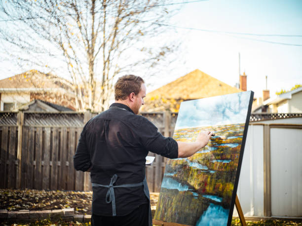 istock Man painting art in the backyard 1284935888