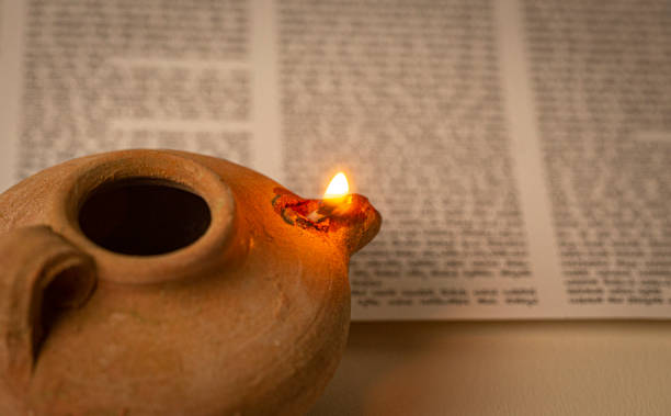 istock An Ancient Lamp Illuminating the Hebrew Text of the Torah 1284936575