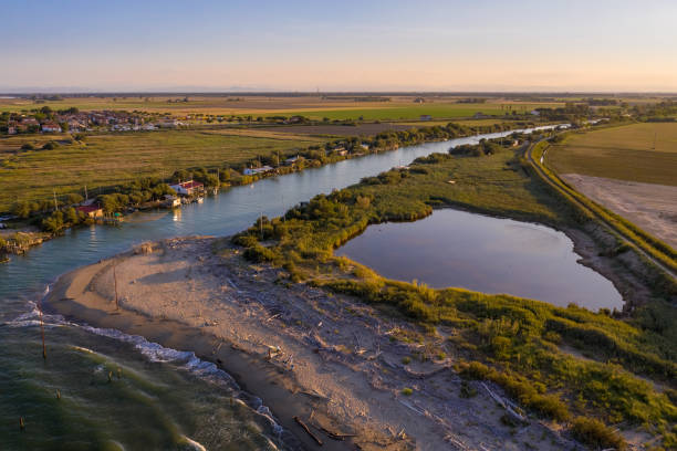 istock where the river flows into the sea at sunset 1284937448