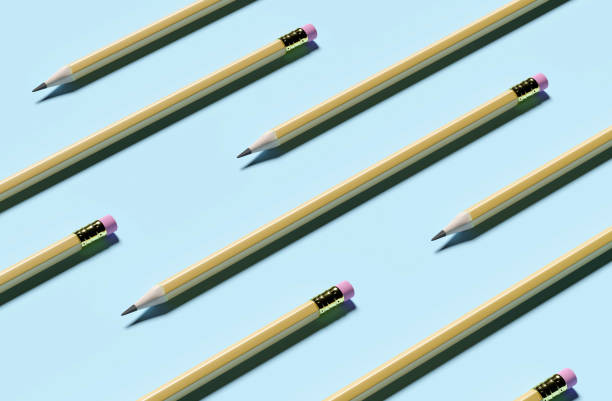 istock Concept of pencils with an eraser lie on a blue background 1284937488