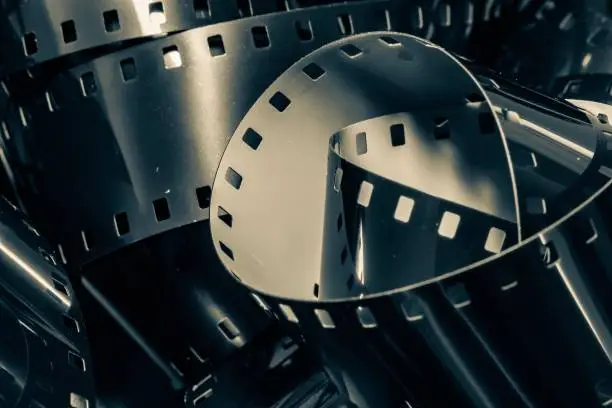 Photo of 16mm movie film reel unraveled