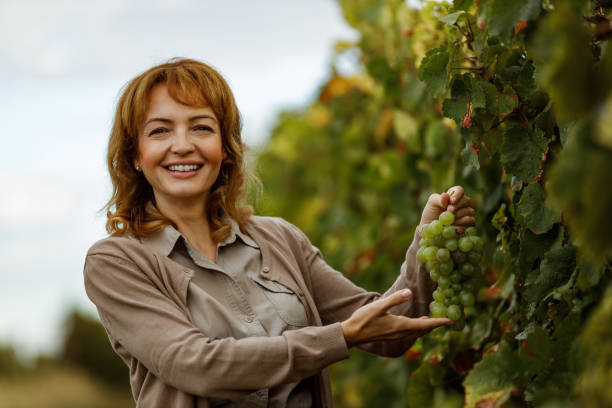 istock Woman standing next to tree line. 1284942474
