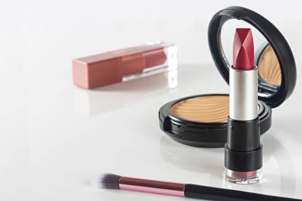 istock Cosmetic products lipstick, powder on white background. 1284942558