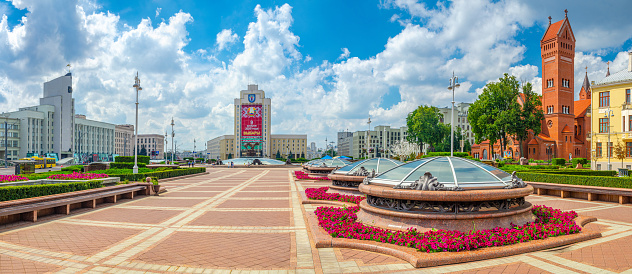 Minsk, Belarus, July 26, 2020: Maxim Tank Belarusian State Pedagogical University, Saints Simon and Helena Roman Catholic church or Red church and Minsk Metro headquarters on Independence Square