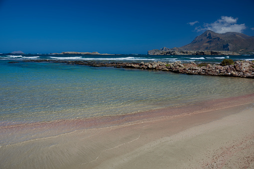 Beautiful turquoise sea and coral pink sands of Falasarna Bay, Crete