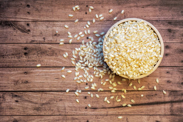 istock Risotto in a bowl with a wooden background and copy space 1284945089