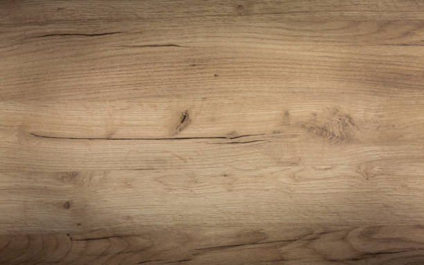 istock Brown wooden shield with knots and cracks, background 1284948849