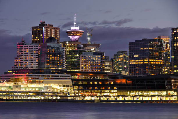 vancouver downtown cityscape during sunset, orange city lights, british columbia, canada - vancouver harbor imagens e fotografias de stock