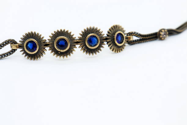 istock bronze bracelet with blue crystals, white background 1284951949
