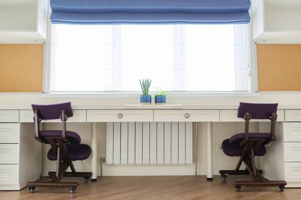 istock Home office, workplace for two people, desk near the window 1284952436