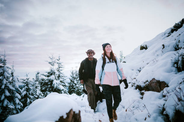 istock Hikers and Dog in Snow Covered Pacific Northwest 1284954444