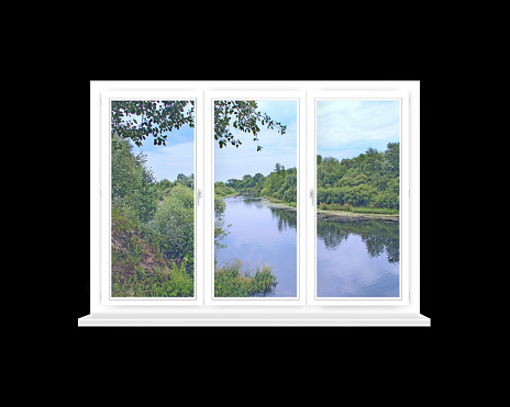 panoramic window with view to the beautiful forest river. View from window to pine forest and lake. Landscape seen from room window