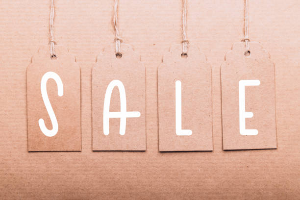 Word sale written on paper tags