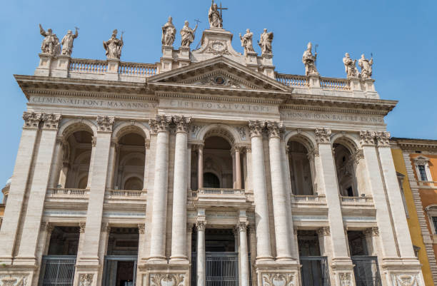 The Basilica of San Giovanni in Laterano in Rome with blue sky stock photo