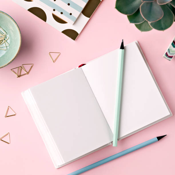 istock Mockup with set of notepads, pencils and clips. 1284957347