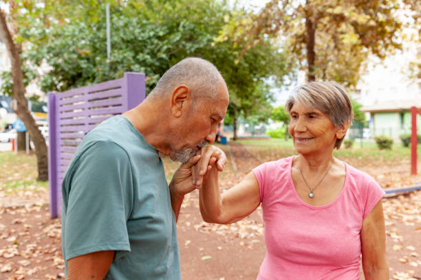 istock Husband kissing his wife's hand 1284958321